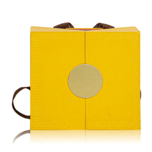 Front view of custom luxury yellow rigid gift box with ribbon handle for wholesale.