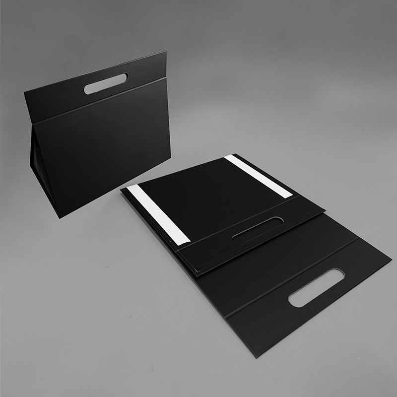 Luxury black triangle foldable gift box showing both flat and assembled state.