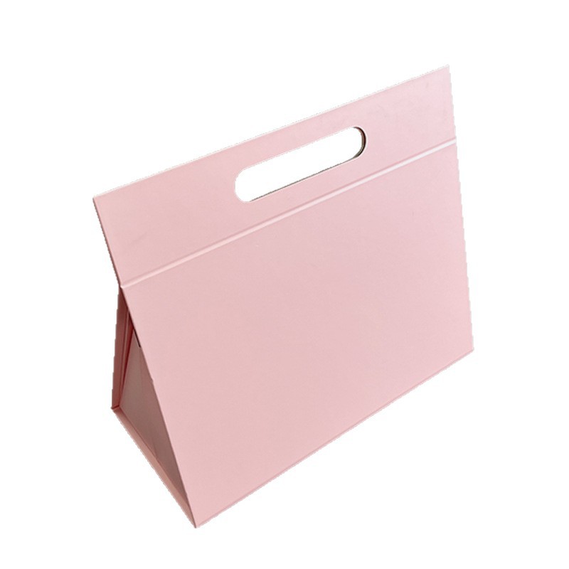 Custom pink triangle rigid gift box featuring a built-in die-cut handle for easy carrying.
