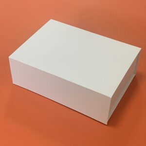 Custom white foldable rigid gift box for wholesale apparel packaging.