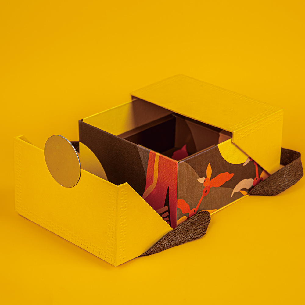 Luxury yellow rigid gift box with unique double door opening and decorative internal printing.